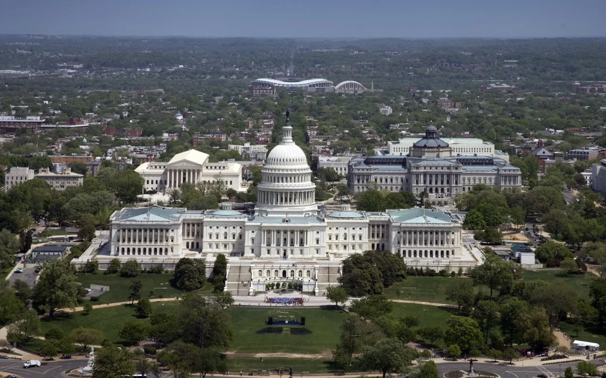 Aerial view of the United States Capitol atop Capitol Hill at the east end of the National Mall